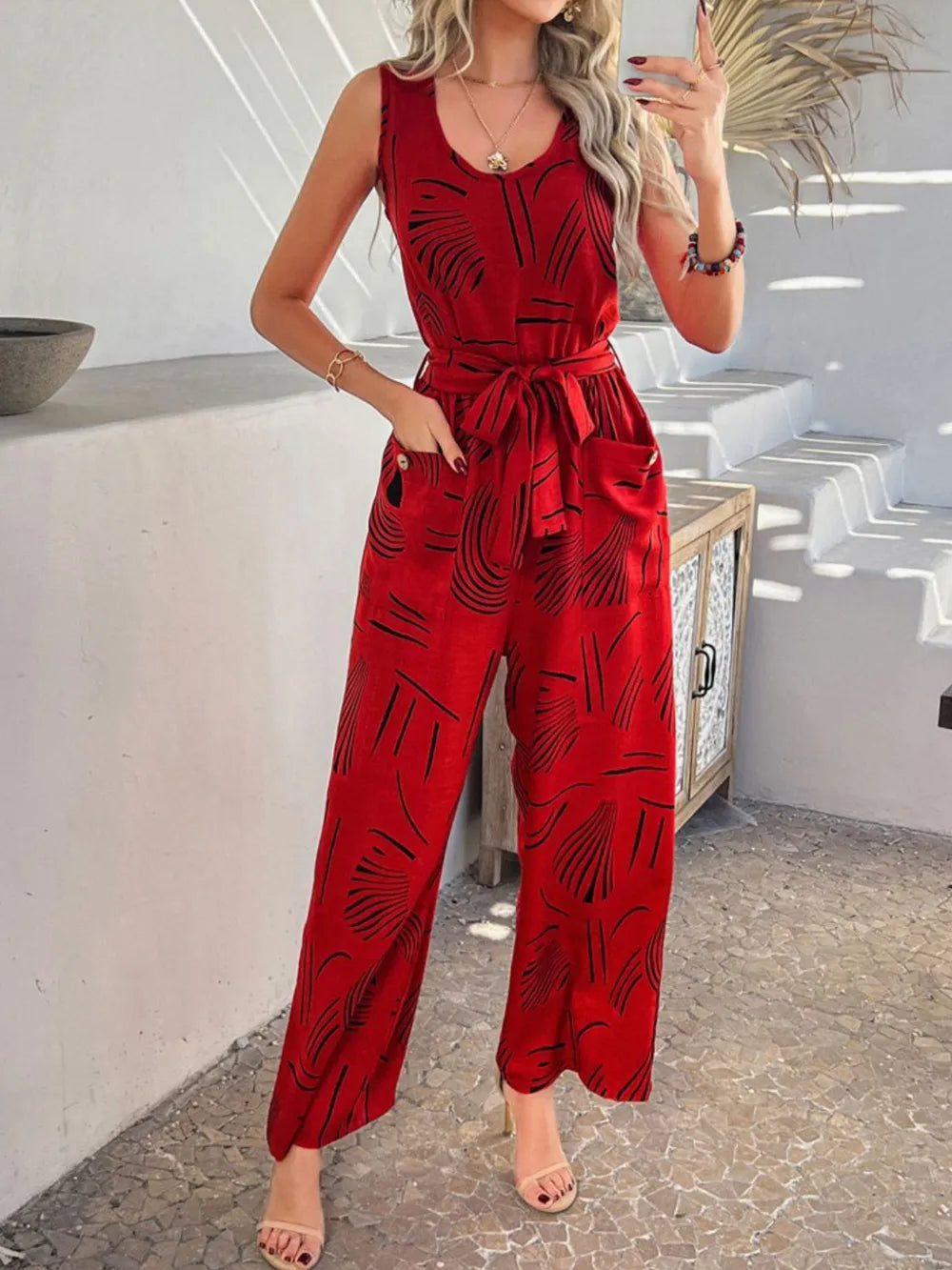 Devine Printed Round Neck Sleeveless Tie Waist Jumpsuit